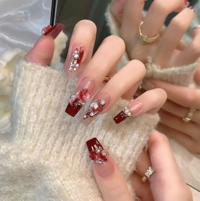 Artistic Nail Art with Glitter and Flower Applications Kalsten