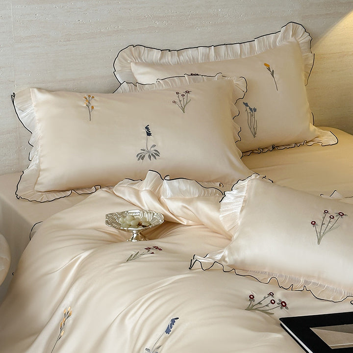 Satin bedding set with pleated frill and delicate embroidery
