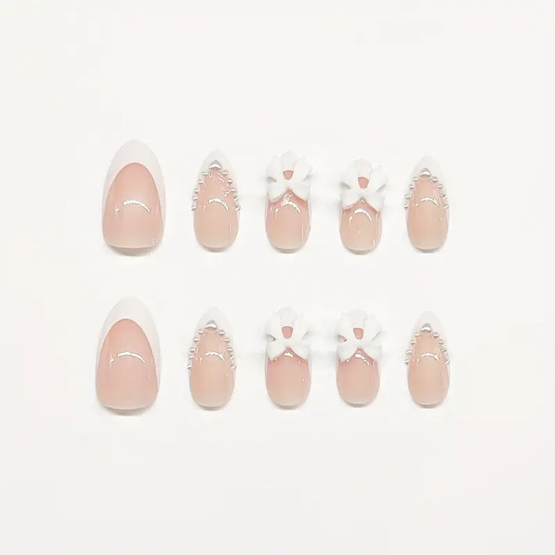Artistic Press-On Nail Design with Bow Accents Kalsten