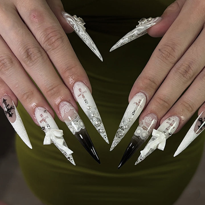 Artful stiletto nails with unique 3D elements and glitter accents Kalsten