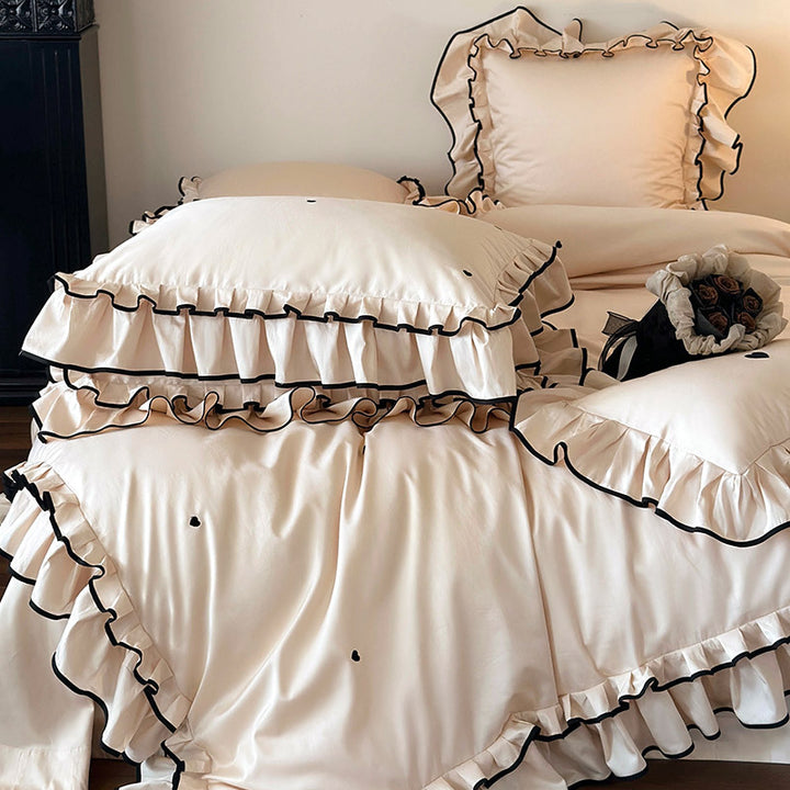 Cotton satin bed set with double-layer ruffled trim, contrast edge and heart embroidery