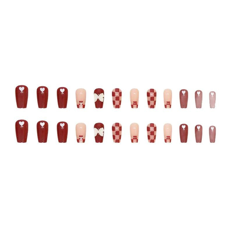 Artificial nails with decorative heart and bow details Kalsten