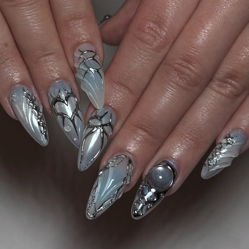 Artful stiletto nails with playful metallic details Kalsten