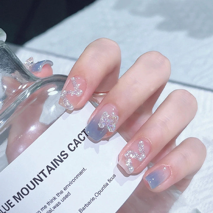 Acrylic nail set with sparkling glitter elements and appealing ombre design Kalsten