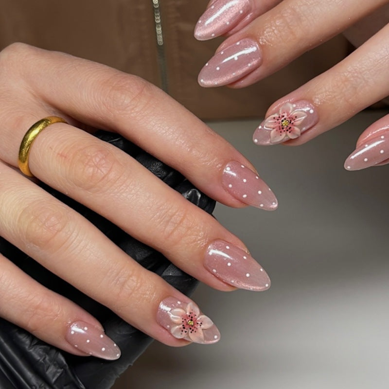 Artificial nail set with glitter and delicate floral and rhinestone embellishments Kalsten