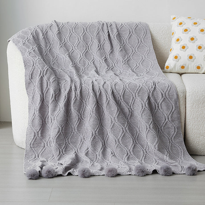 Ladies knit blanket with decorative pom poms Kalsten