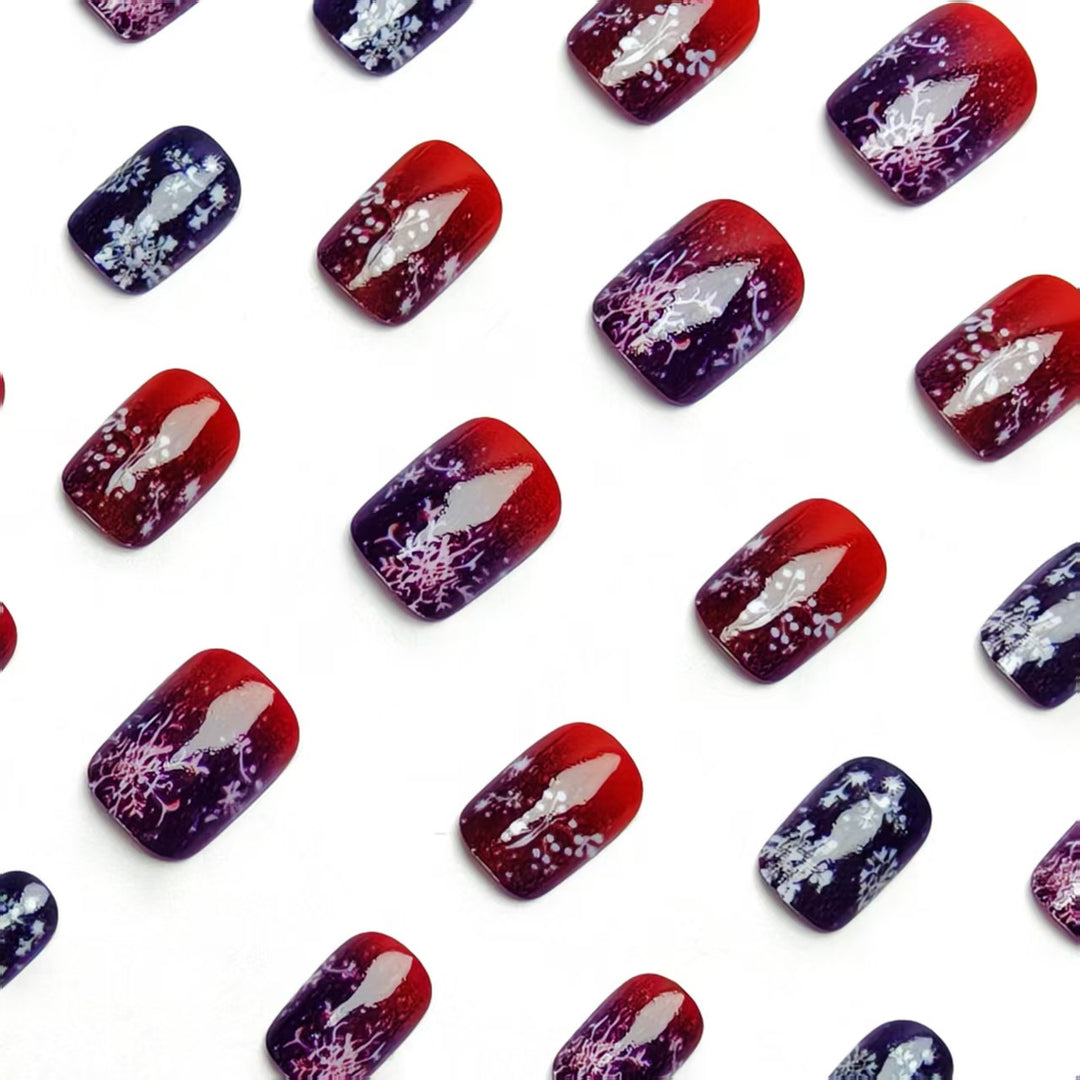 Artificial nails with festive glitter effect and wintry snow motif Kalsten