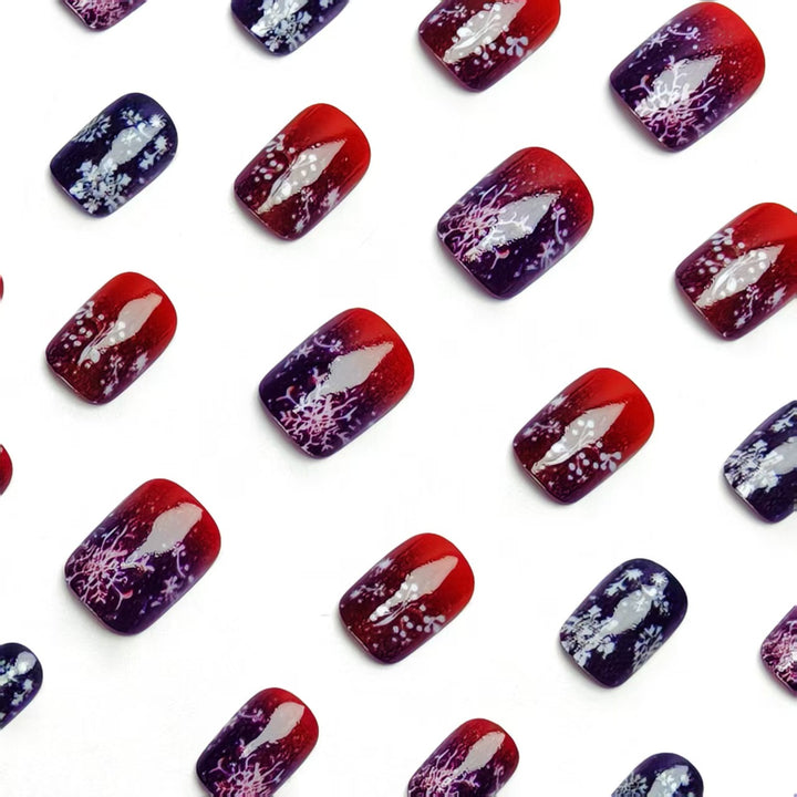 Artificial nails with festive glitter effect and wintry snow motif Kalsten