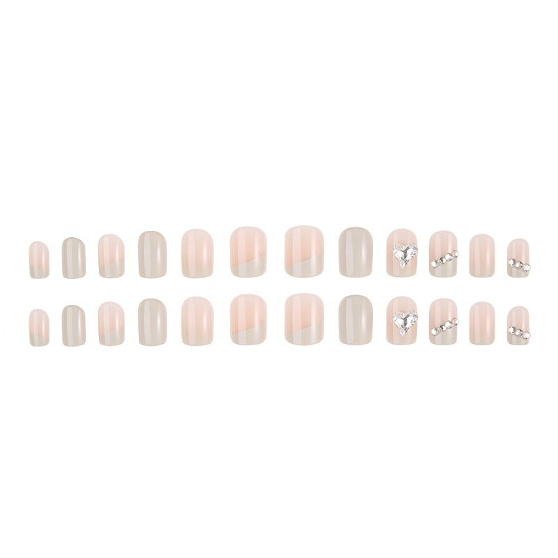 Glamorous artificial nails with heart and rhinestone decorations Kalsten