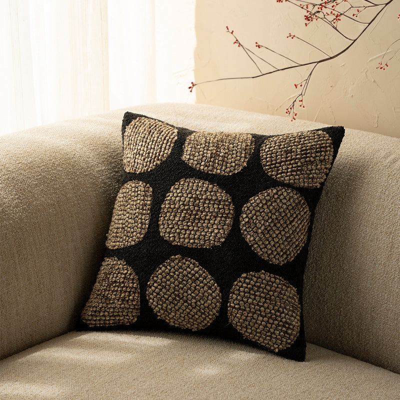 Decorative cushion cover made of textured bouclé weaving technique with raised round appliqués