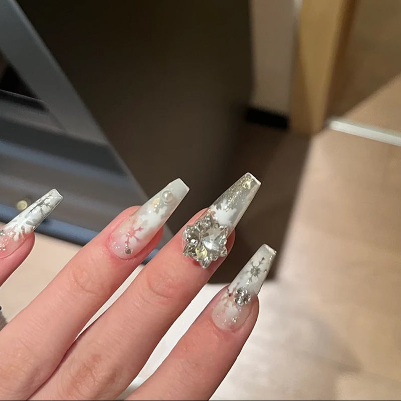 Artificial nail set with frosty snowflake design and sparkling 3D applications Kalsten