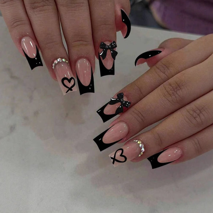 Acrylic nail set with elegant heart and bow design Kalsten