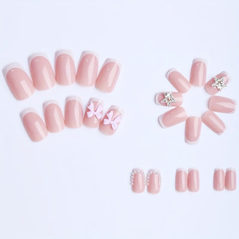 Artificial nail tips with glamorous bow and rhinestone design Kalsten