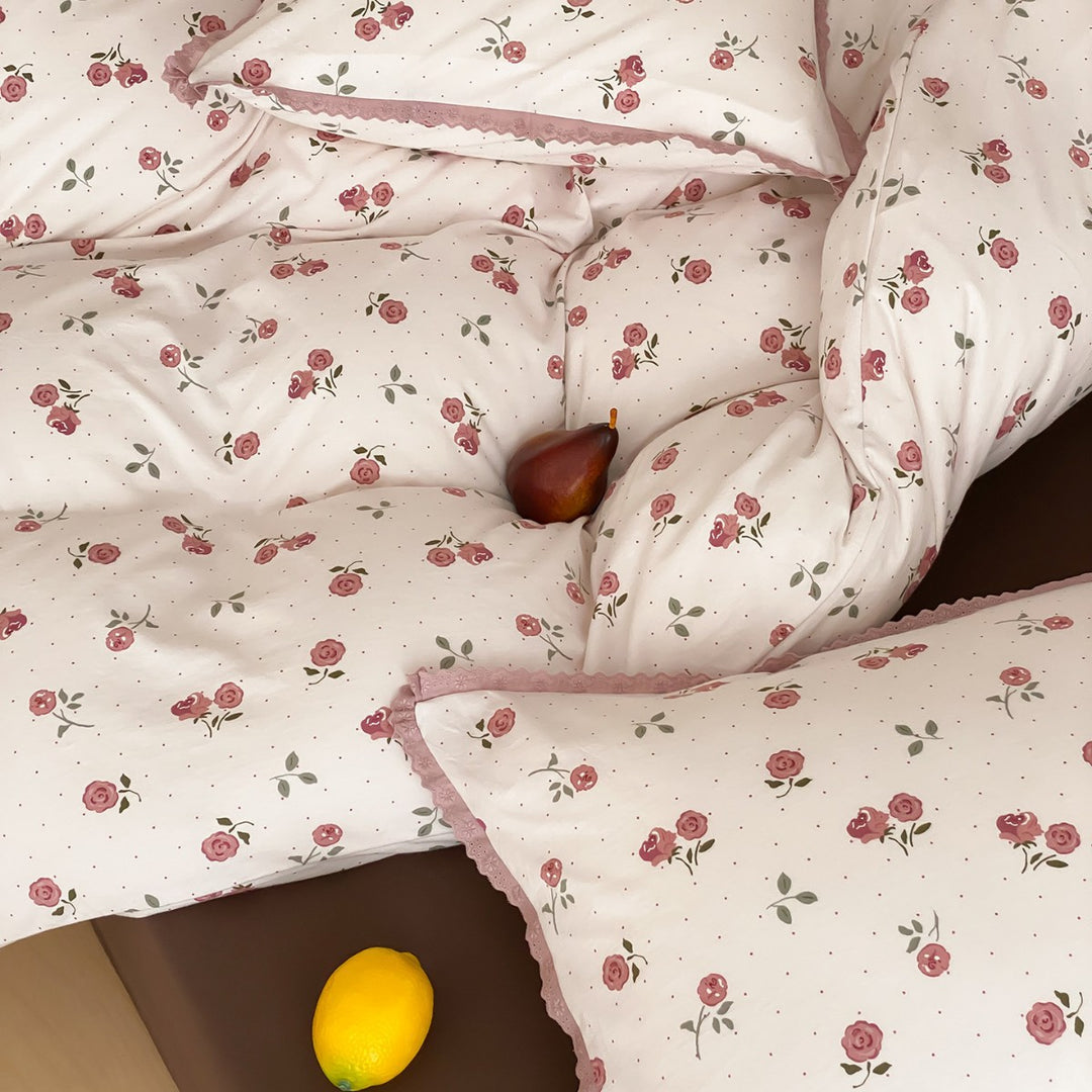 Finely woven cotton percale bedding set with delicate floral print and crocheted lace edge