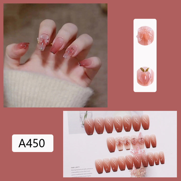 Glamorous artificial nails with heart design and glittering accents Kalsten