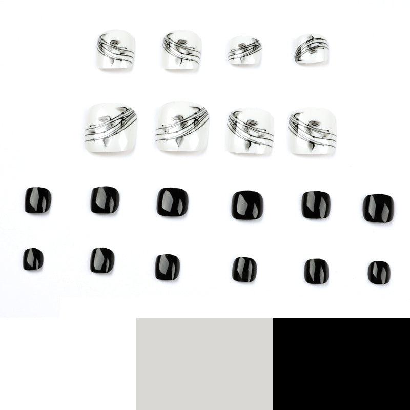 Artful toenail art in elegant black and white design Kalsten