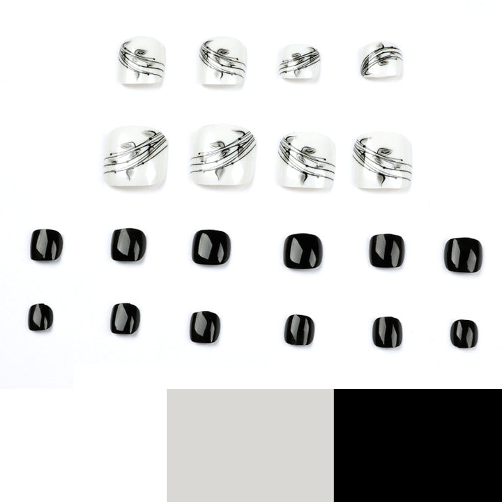 Artful toenail art in elegant black and white design Kalsten