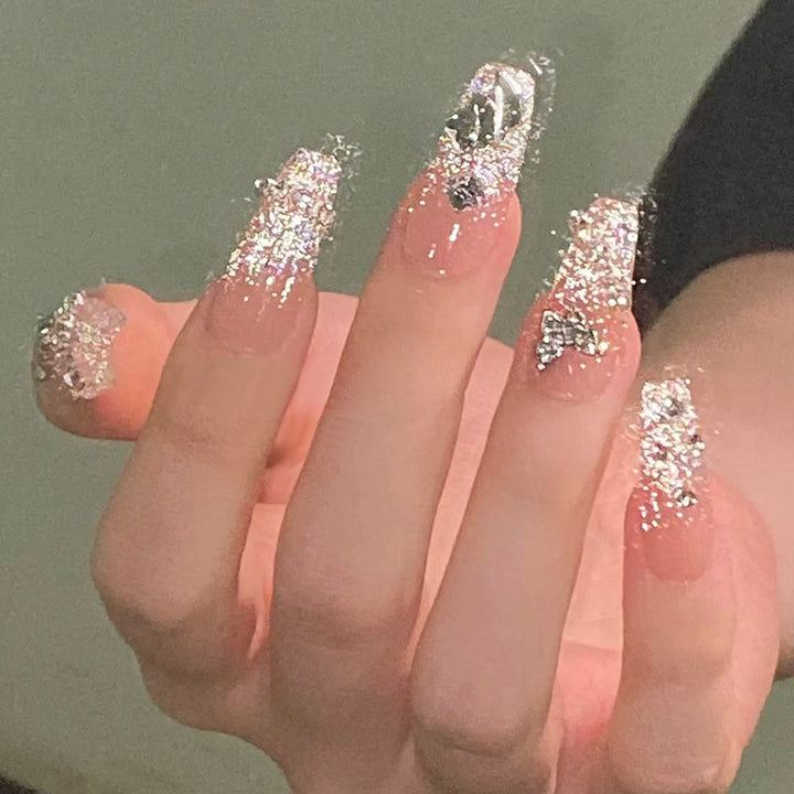 Glamorous artificial nails with sparkling rhinestones and elegant designs Kalsten