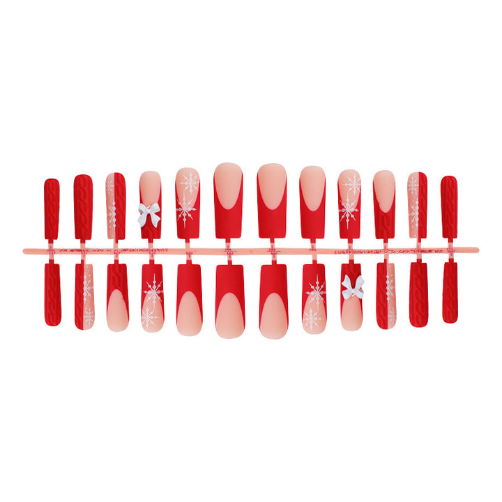 Artificial nail set with festive snowflake and bow motifs Kalsten