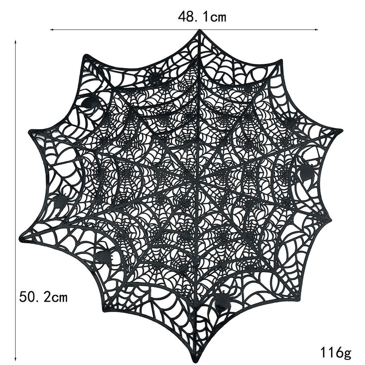 Flexible spiderweb table mat made of heat-resistant silicone as a placemat and decorative coaster with spider relief
