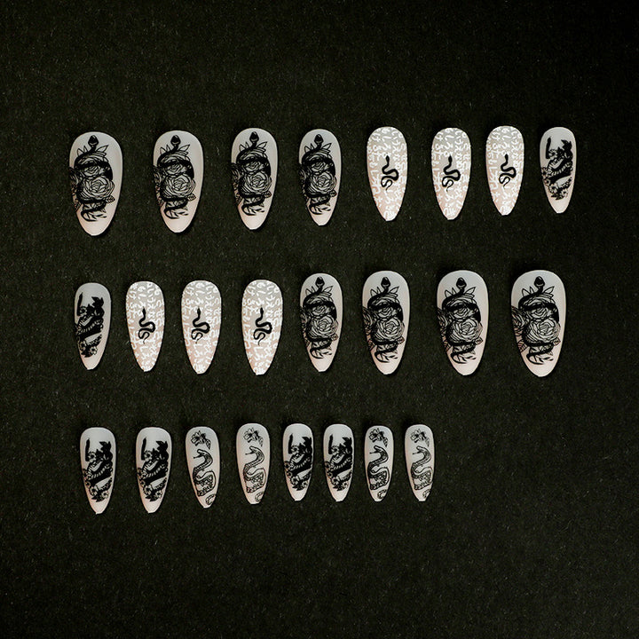 Artful nail extensions in elegant stiletto style with artistic floral and graphic designs Kalsten