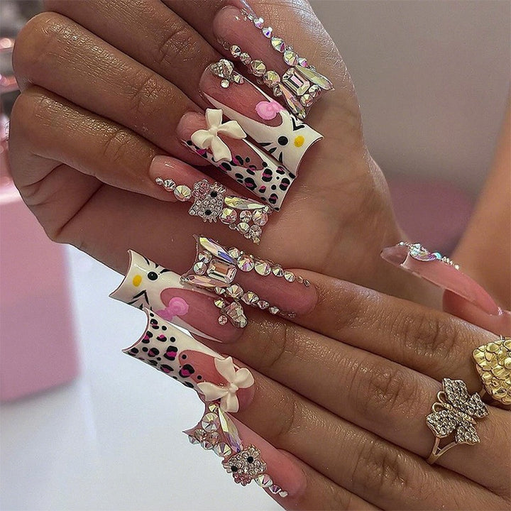 Glamorous artificial nail set with sparkling rhinestone embellishments and creative animal designs Kalsten