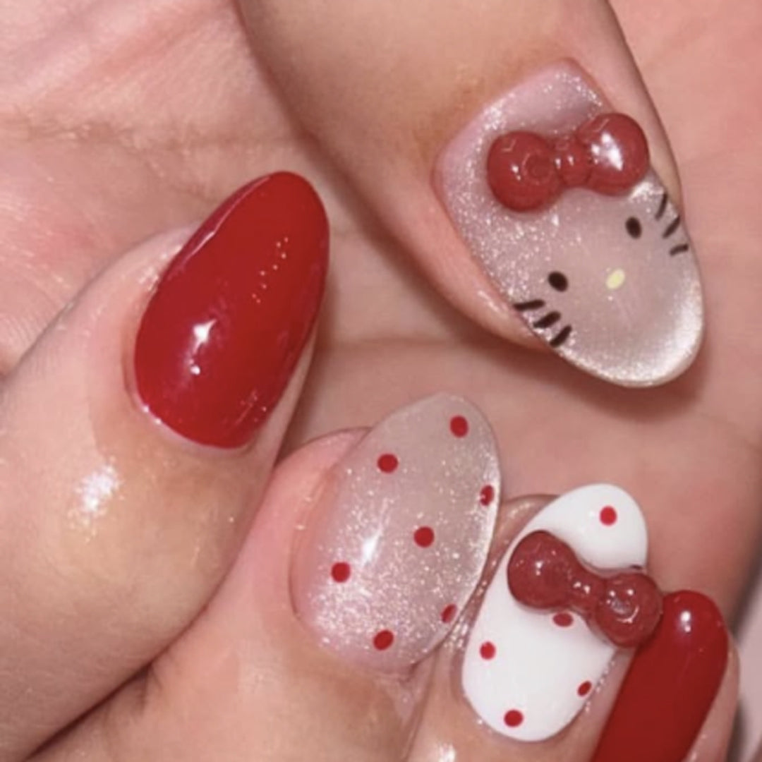 Artificial nail art with playful dots and bows Kalsten