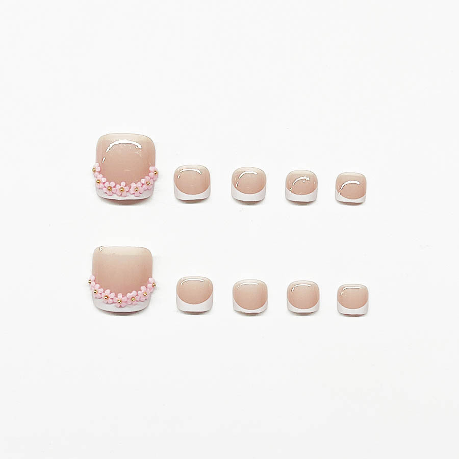 Nail art set with elegant French design and glamorous rhinestone accents Kalsten