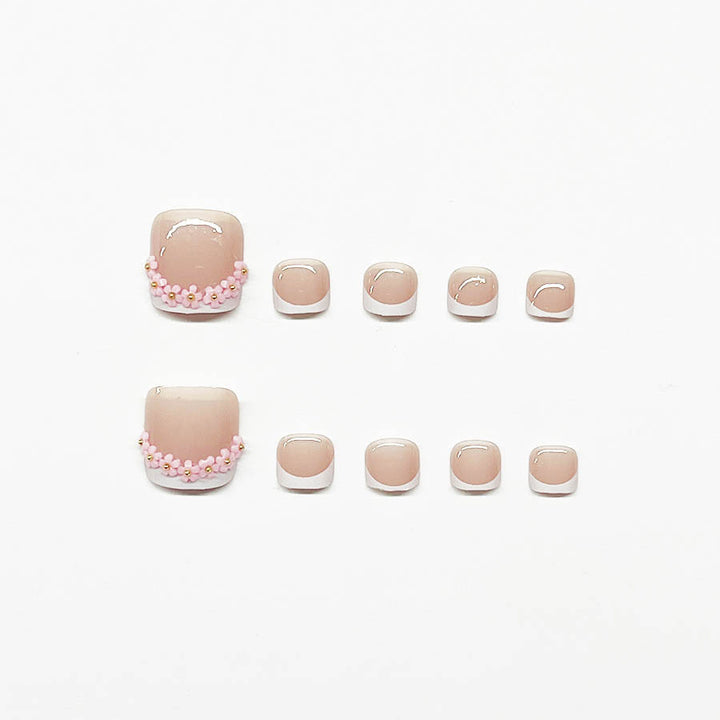 Nail art set with elegant French design and glamorous rhinestone accents Kalsten