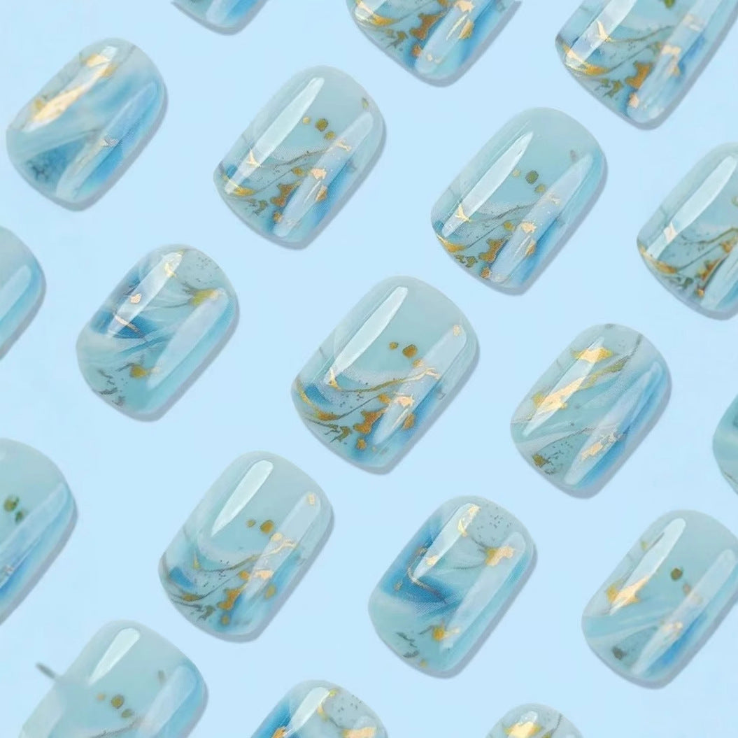 Acrylic nail set with luxurious marble design and gold accents Kalsten
