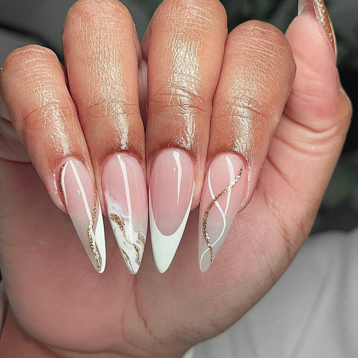 Artful stiletto nails with elegant marble and glitter design Kalsten