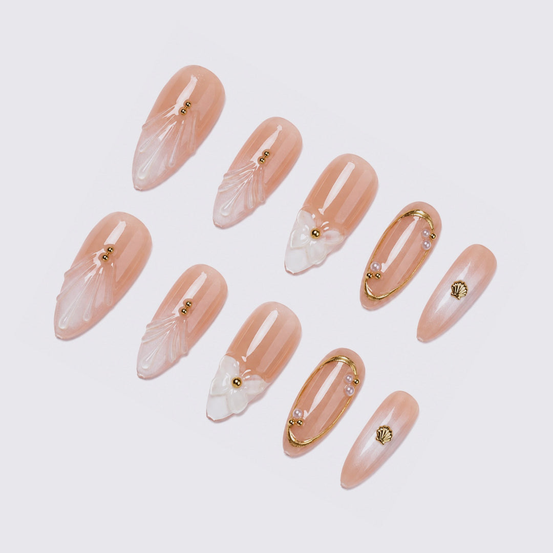 Acrylic nail set with elegant 3D designs and golden accents Kalsten