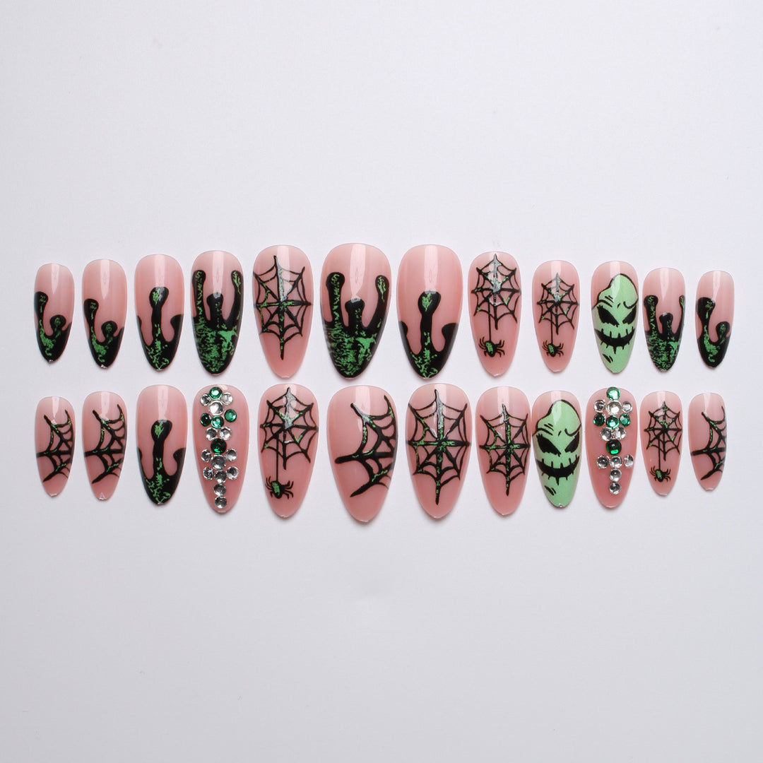 Acrylic nails with Halloween spider design and glitter accents Kalsten