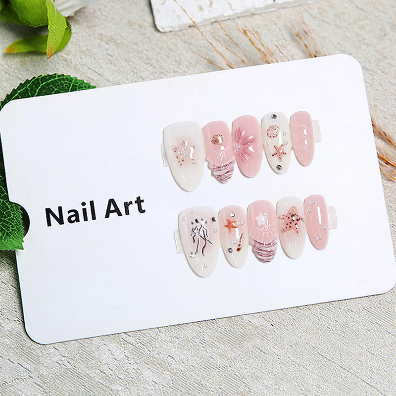 Artificial nails with maritime motifs and pearl embellishments Kalsten