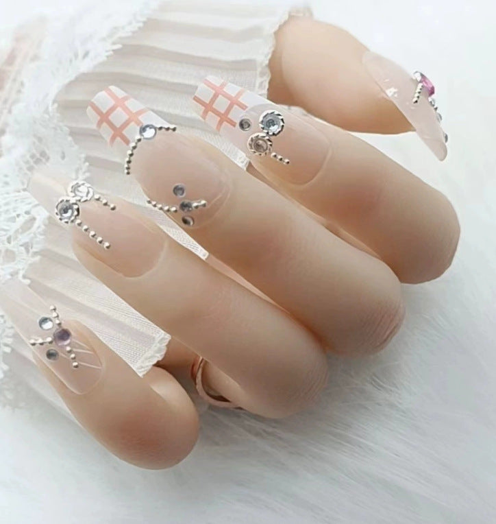 Elegant nail design with pearl embellishment Kalsten