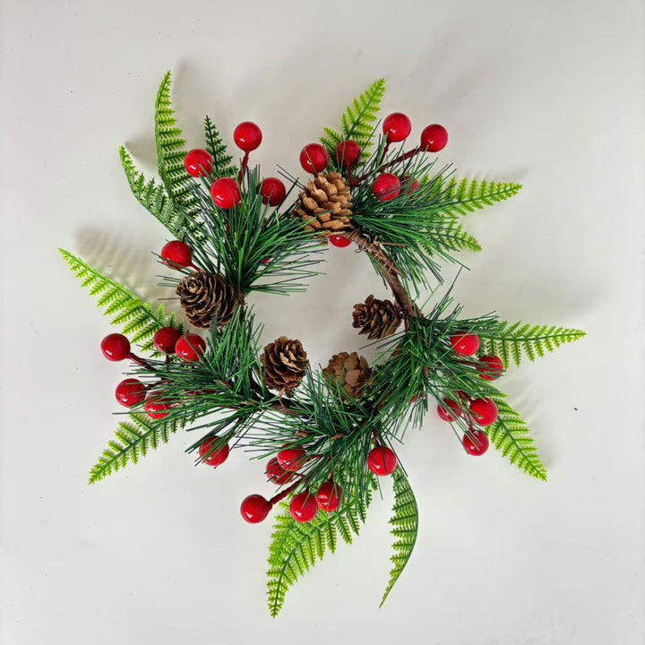 Christmas wreath with pine cones and red berries