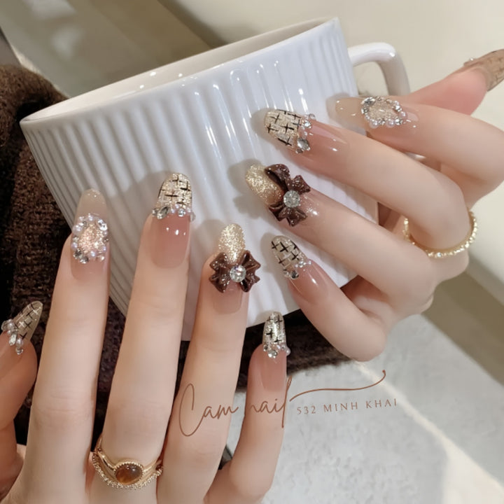 Decorative Press-On Nail Extensions with Bow and Rhinestone Accents Kalsten