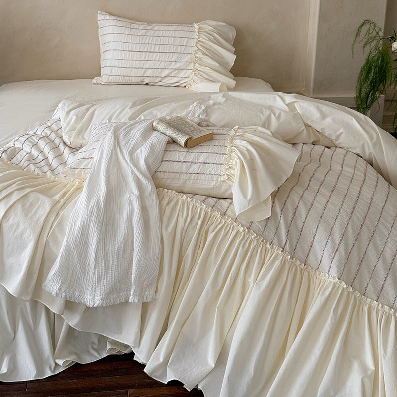 Bedding set made of cotton percale with striped relief embroidery and ruffled bed skirt