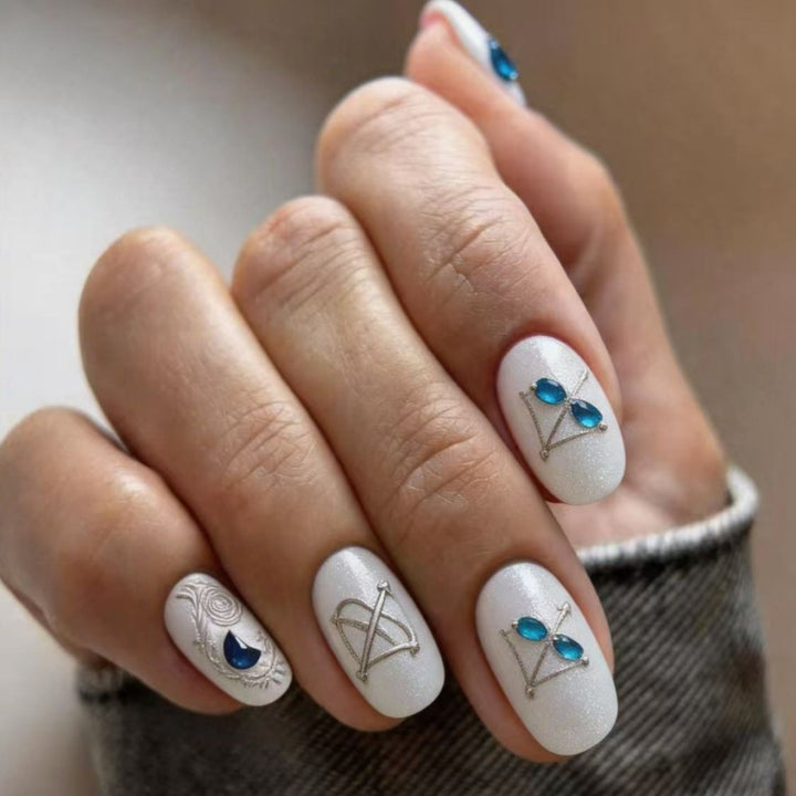 Artificial nails with elegant jewelry embellishments Kalsten