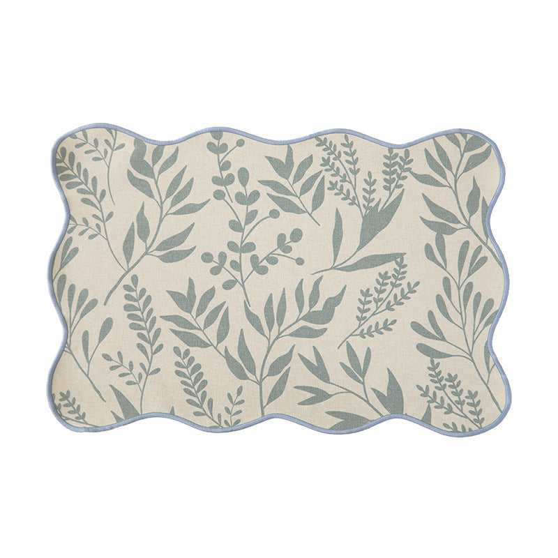 Shaped table set with curved contour and botanical leaf pattern Kalsten
