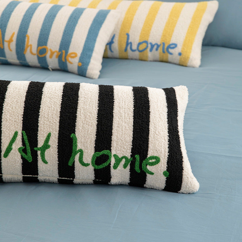 Elongated bench and windowsill cushion with nautical stripe texture and embroidered lettering Kalsten