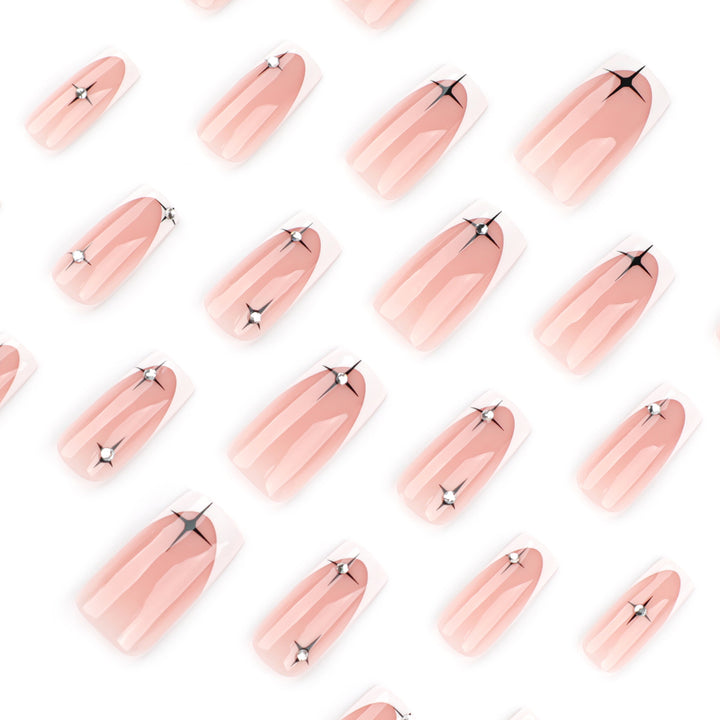Artificial nail extensions with elegant French tip and glitter accents Kalsten