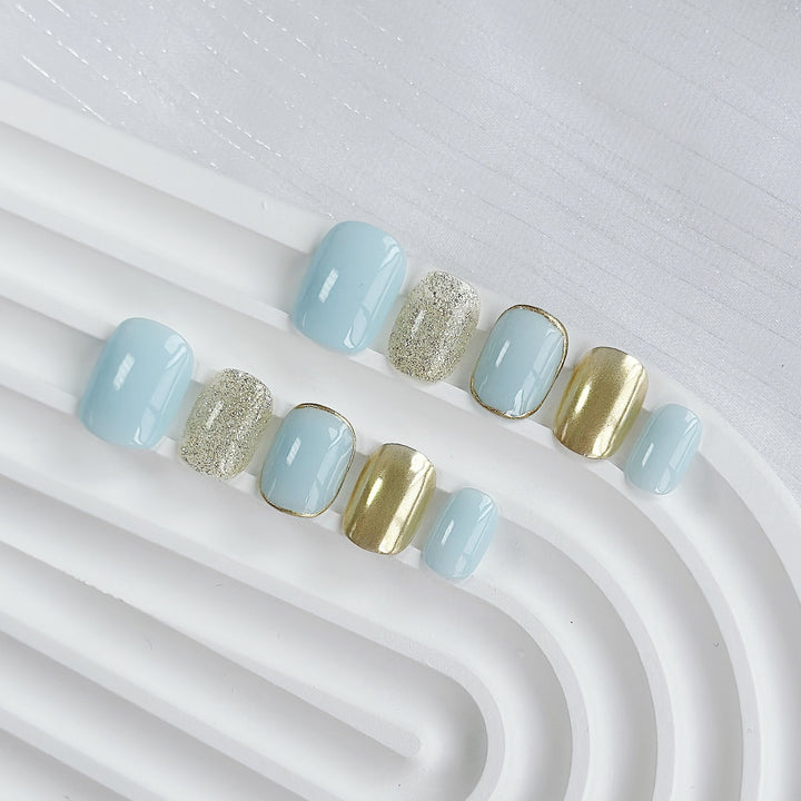 Artistic Press-On Nail Set with Glitter and Metallic Accents