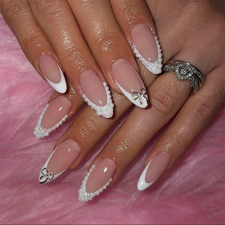 Glamorous artificial nail set with elegant bows and glitter accents Kalsten