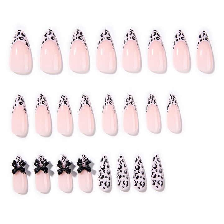 Artful Stiletto Nails with Leopard Print and Bow Accent Kalsten