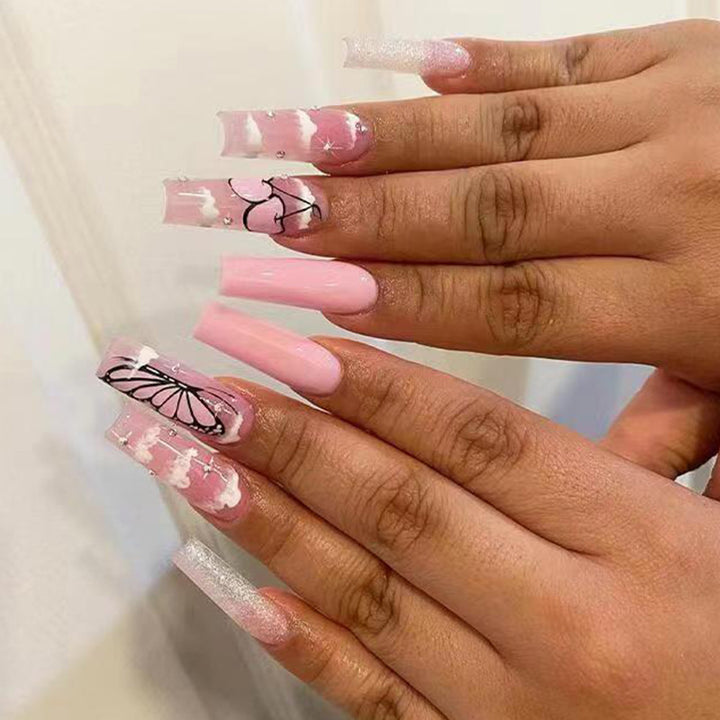 Artificial nail set with romantic butterfly designs and glitter accents Kalsten