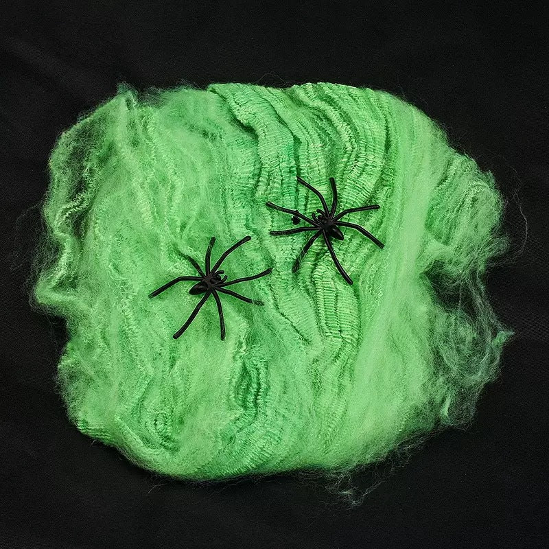 Decorative Halloween spider web with artificial spiders