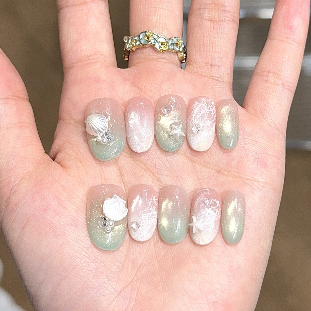 Artificial nail tips with maritime design and glitter effects Kalsten
