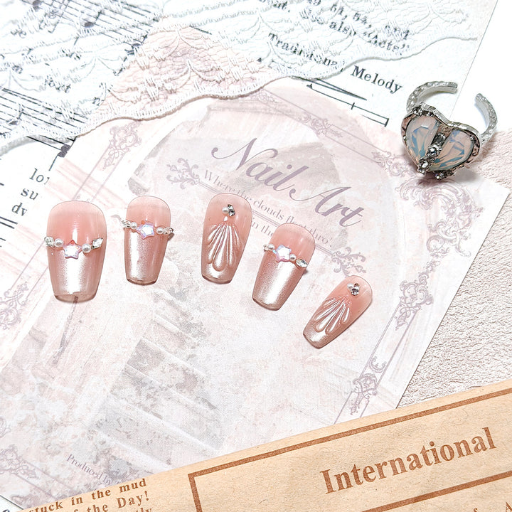 Exquisite artificial nails with glitter and pearl accents Kalsten