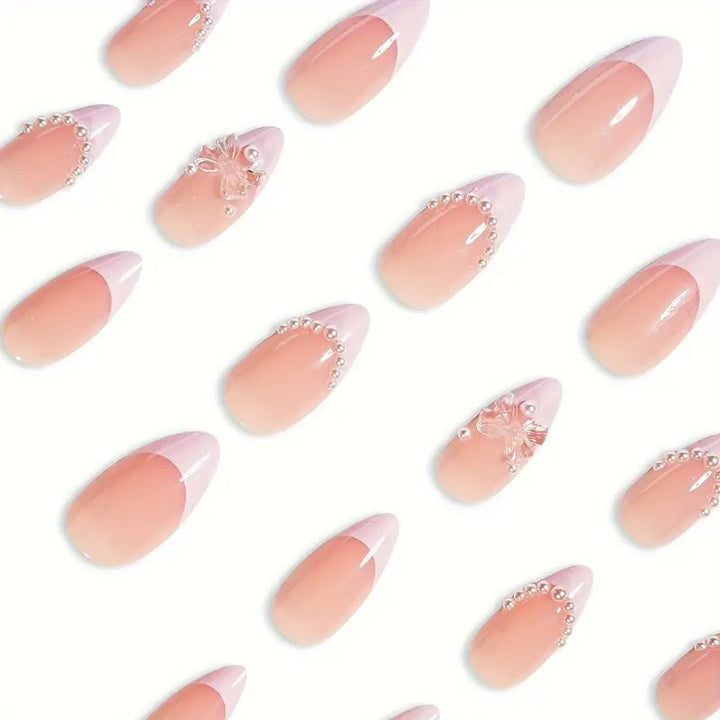 Art nail tips with delicate pearl and butterfly accents Kalsten